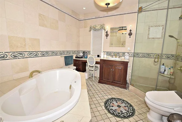 a bathroom with a bathtub and a shower