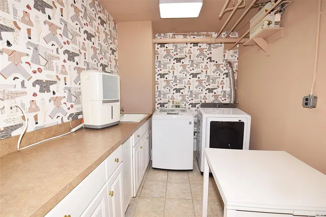 a kitchen with a stove and a white cabinets