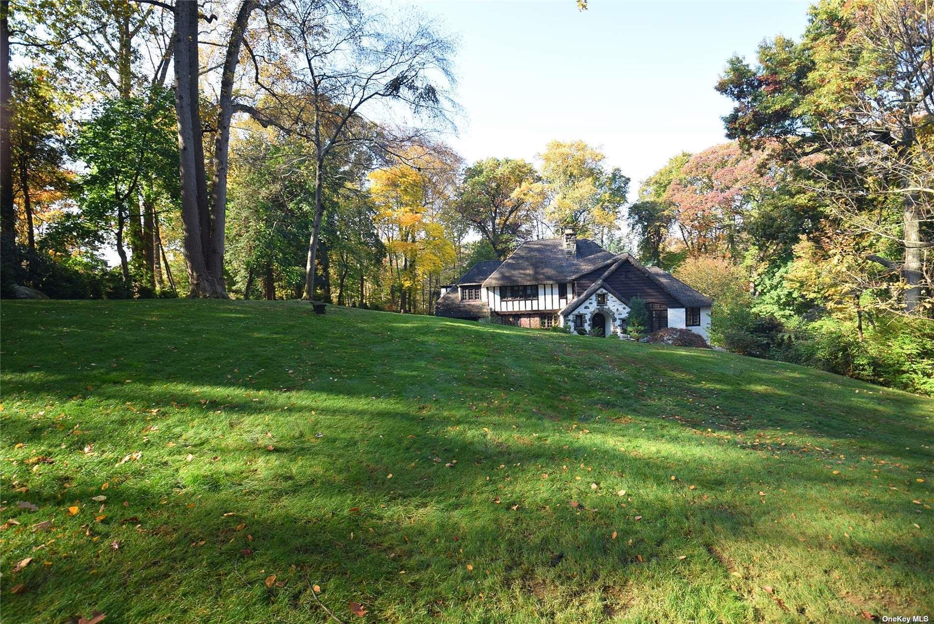 539 Manhasset Woods Road Manhasset, NY 11030 - Photo 28 of 30 a view of a house with a big yard