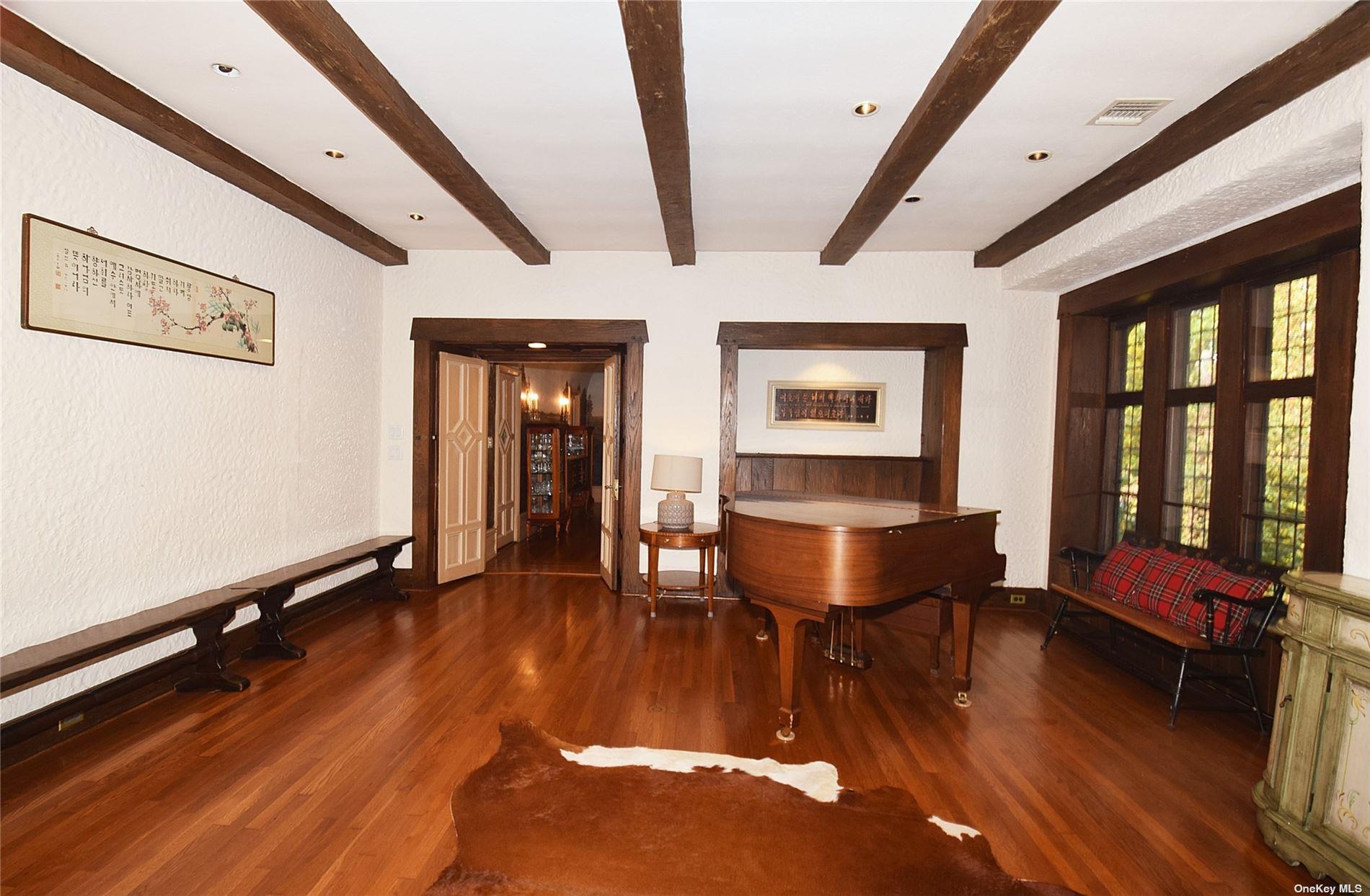 539 Manhasset Woods Road Manhasset, NY 11030 - Photo 7 of 30 a living room with furniture rug and wooden floor
