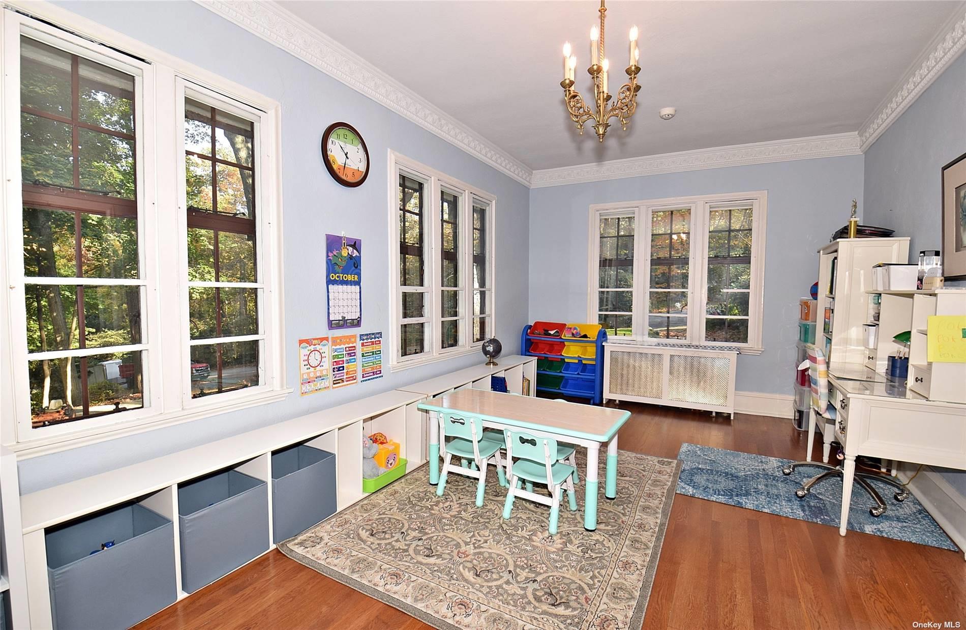 539 Manhasset Woods Road Manhasset, NY 11030 - Photo 8 of 30 a view of a dining room with furniture window and wooden floor