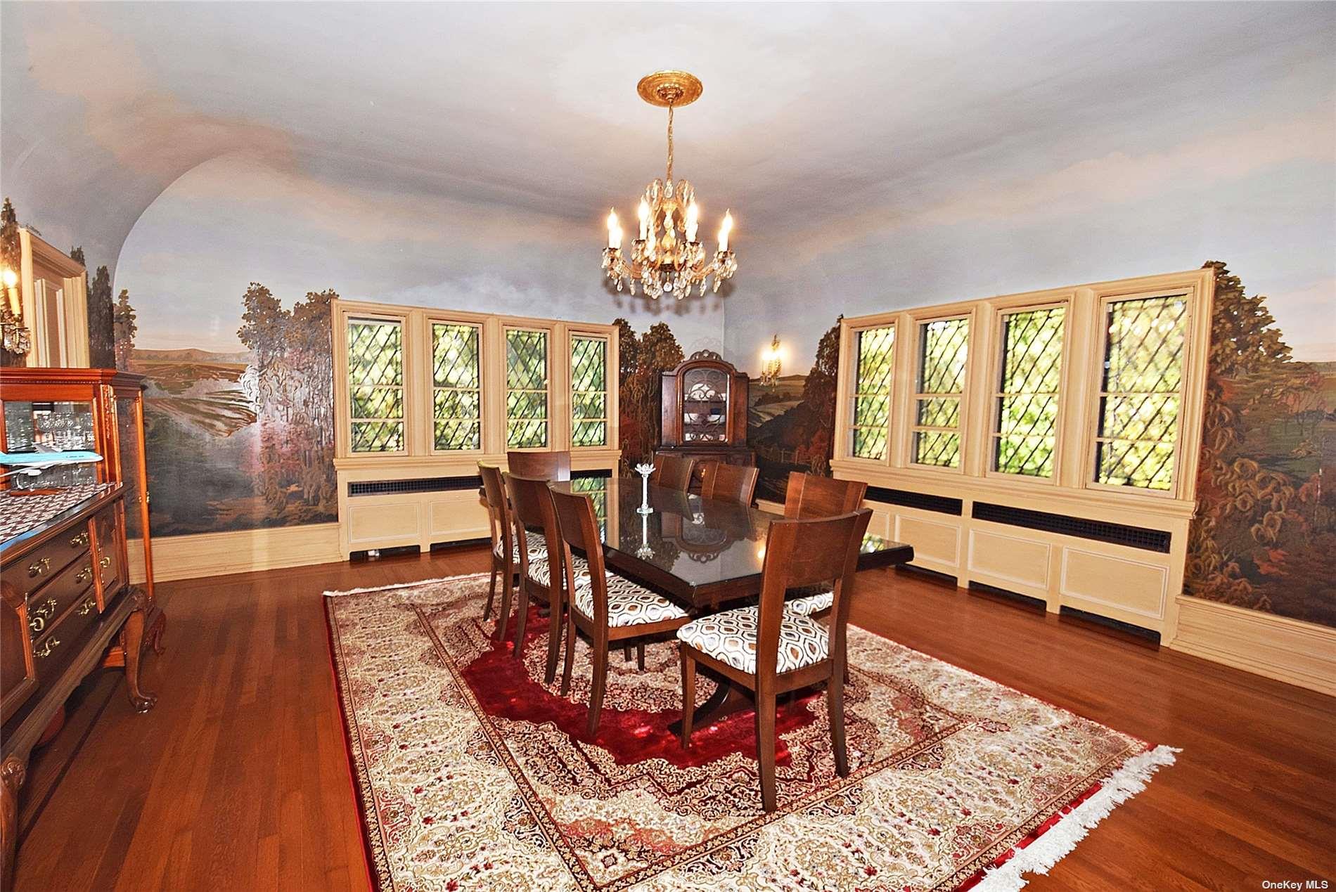 539 Manhasset Woods Road Manhasset, NY 11030 - Photo 9 of 30 a view of a dining room with furniture a chandelier and wooden floor