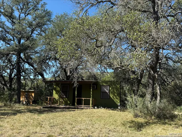 a house with trees in front of it