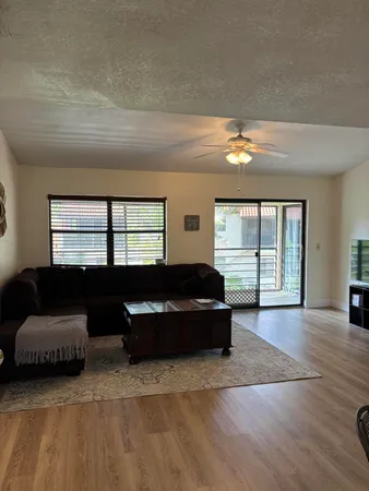 a living room with a couch and a window