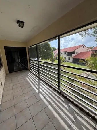 a view of a balcony with an outdoor space
