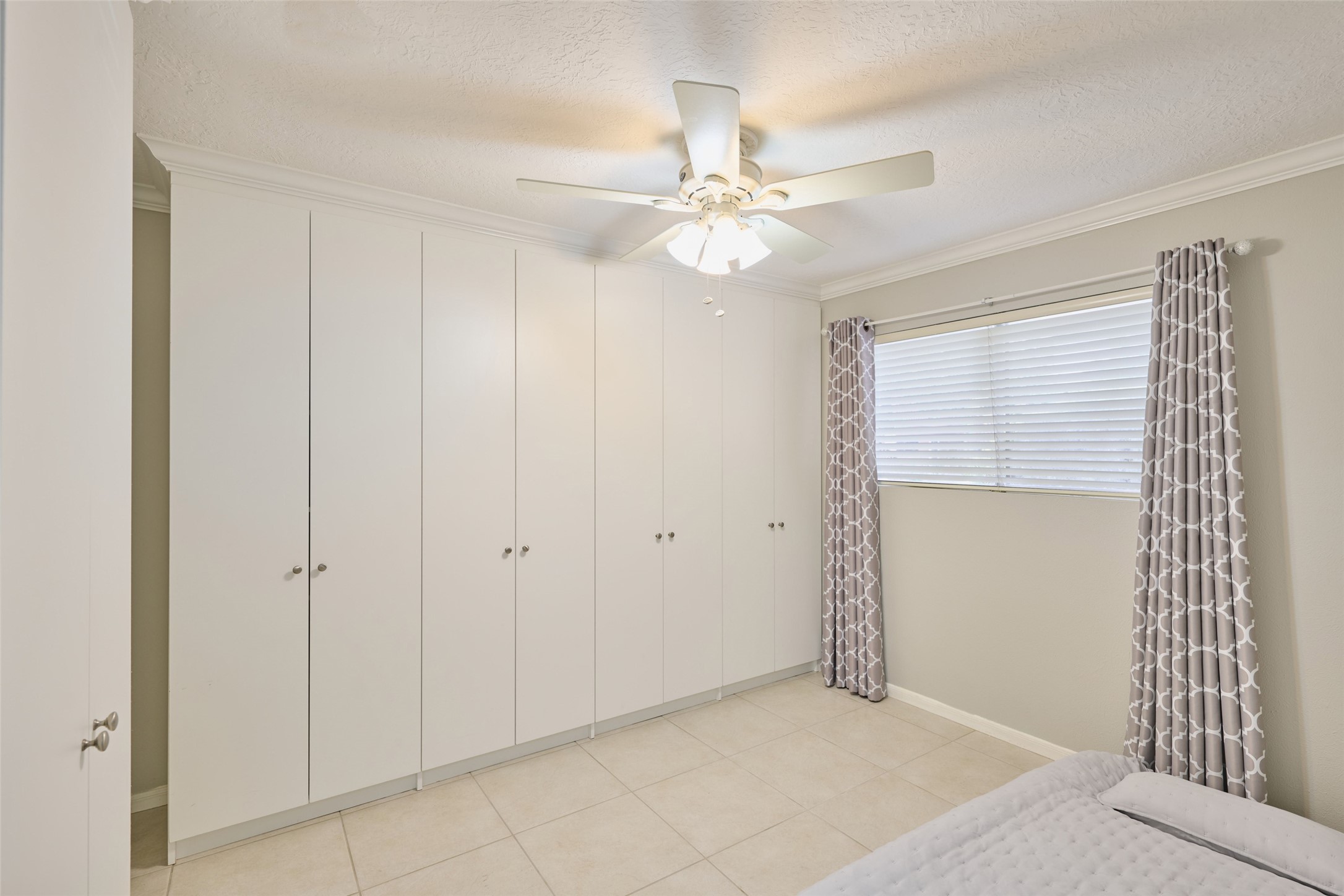 801 River Road, Unit 105D Montgomery, TX 77356 - Photo 20 of 32 Front guest bedroom features tons of storage space in these built-in cabinets. They can be removed if new owner chooses too. There is a closet to the left of these cabinets