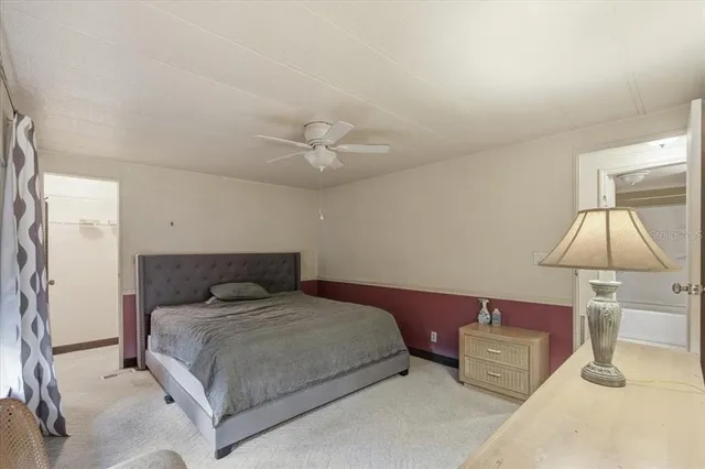 a bed room with a bed and a chandelier