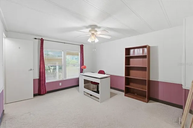 a room with furniture a chandelier and a window