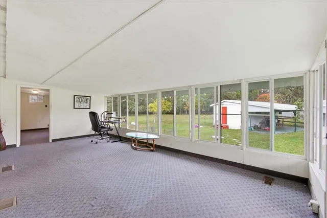 a view of a house with backyard