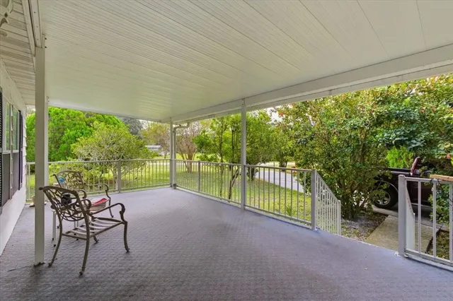 a view of a room with furniture and garden