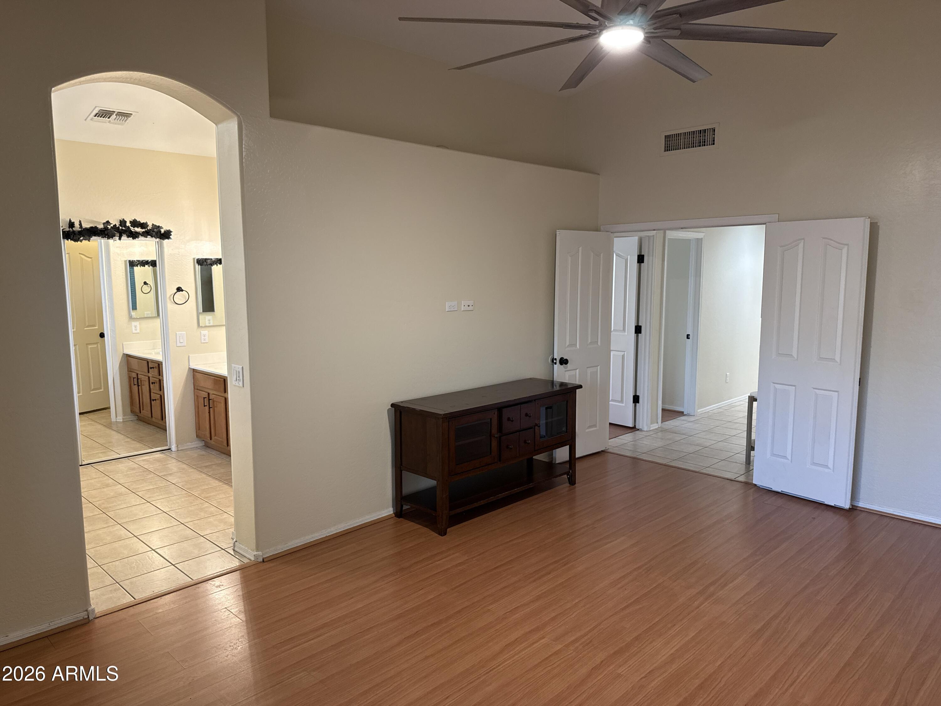 9630 West Reno View Drive Peoria, AZ 85345 - Photo 8 of 21 wooden floor in an empty room with a window