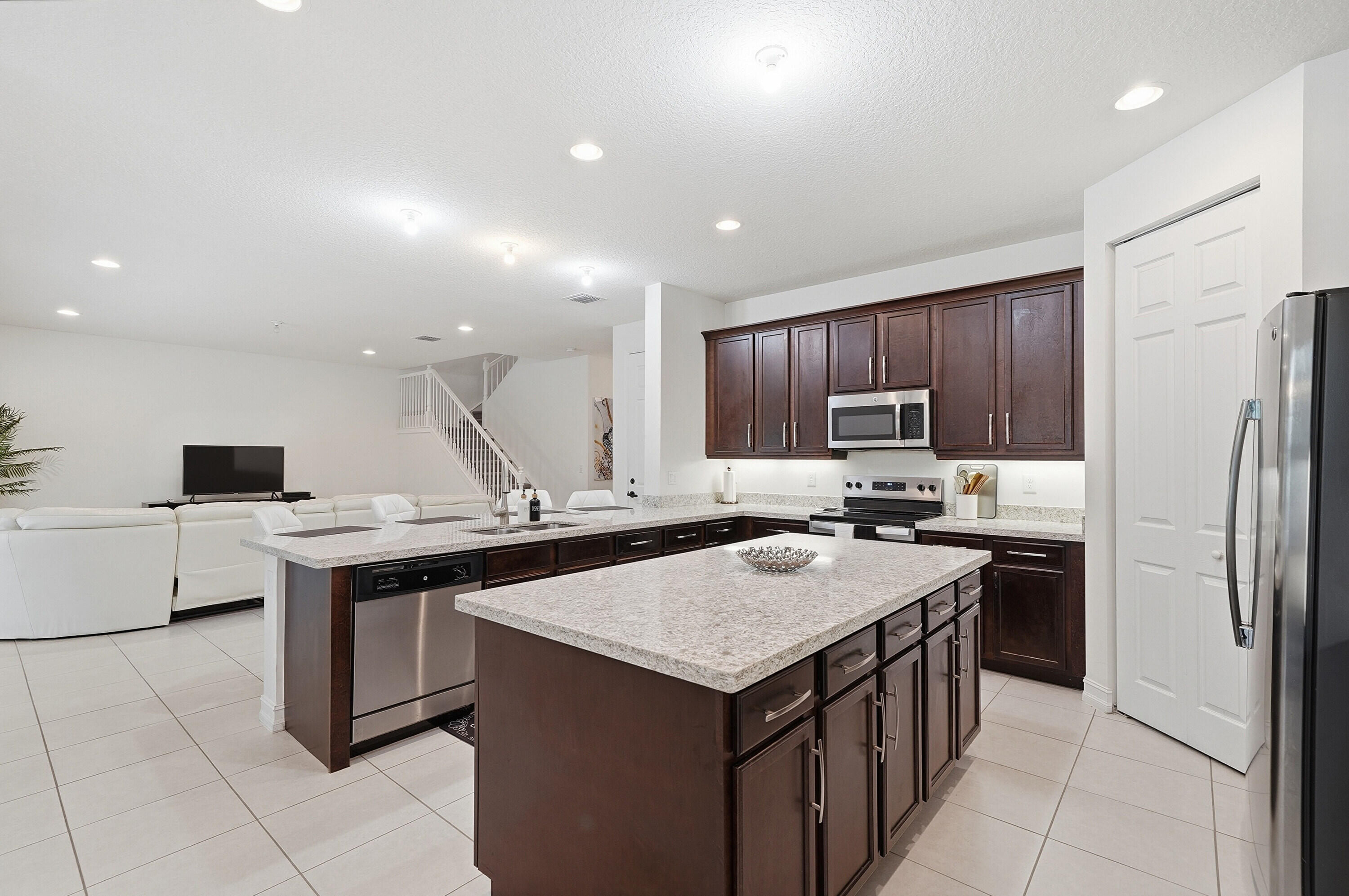 14085 Paverstone Terrace Delray Beach, FL 33446 - Photo 12 of 46 a kitchen with a sink a stove a refrigerator and a cabinets