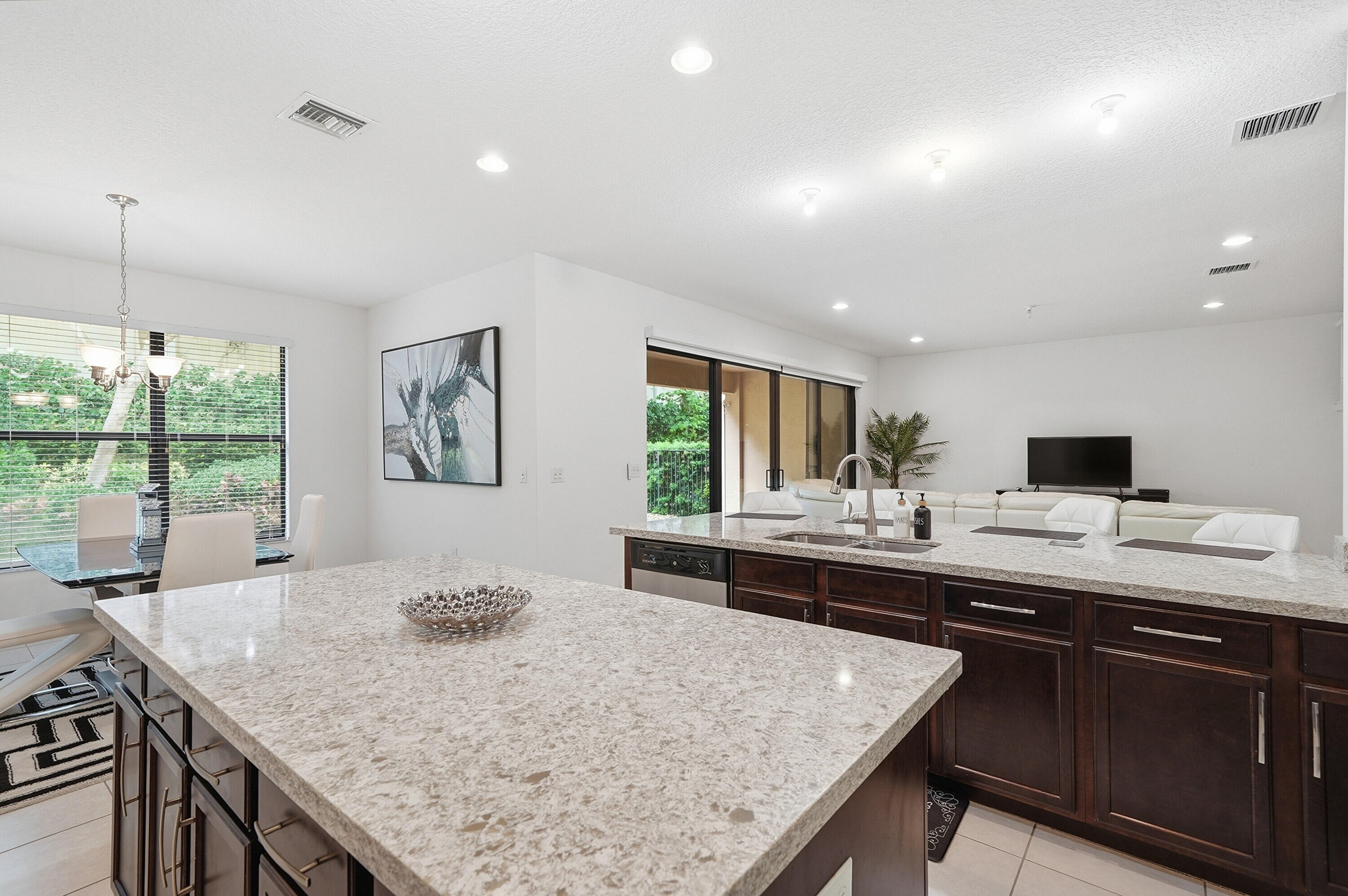 14085 Paverstone Terrace Delray Beach, FL 33446 - Photo 13 of 46 a kitchen with a stove and a sink