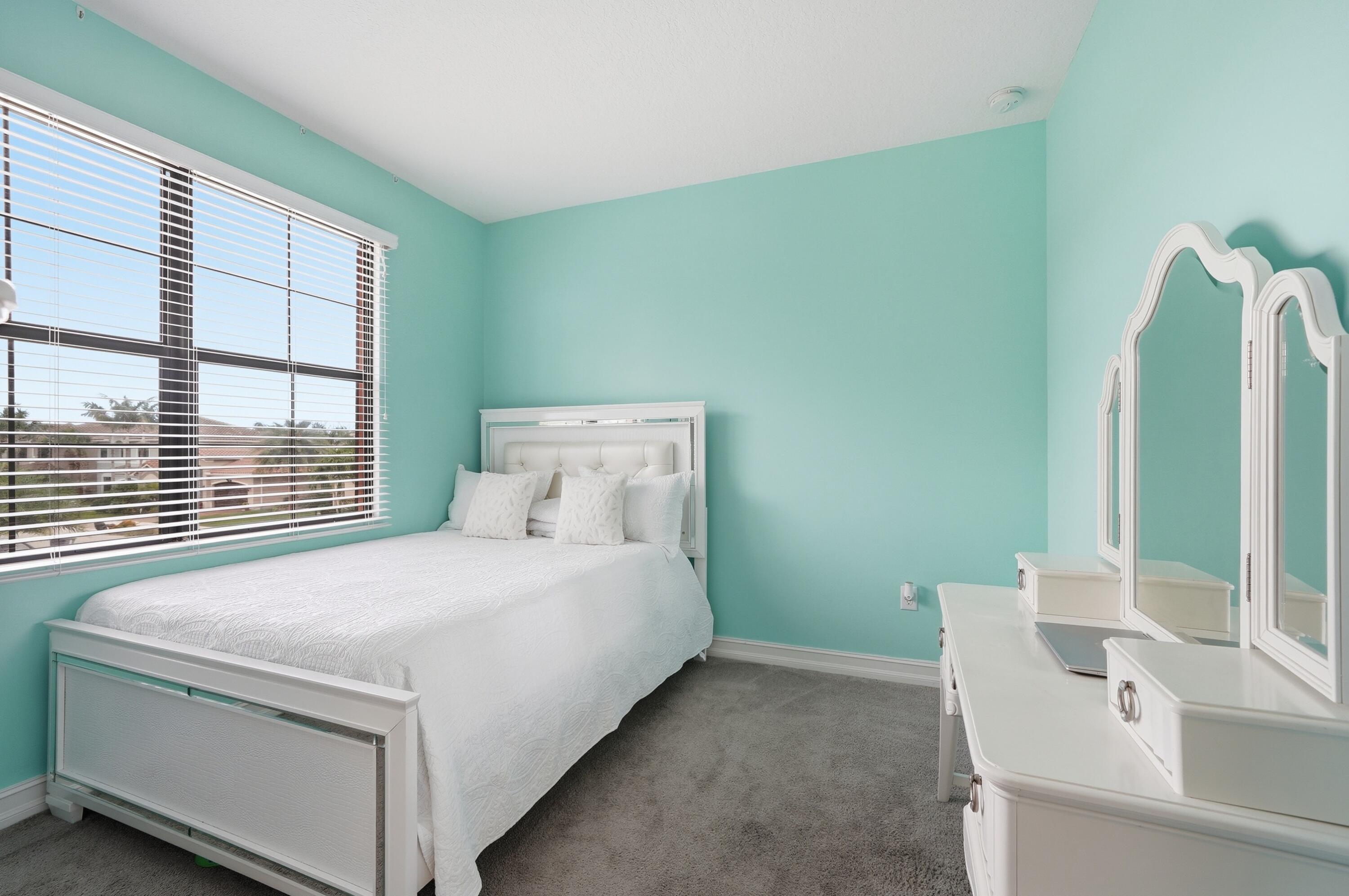 14085 Paverstone Terrace Delray Beach, FL 33446 - Photo 20 of 46 a bedroom with a bed and a large window