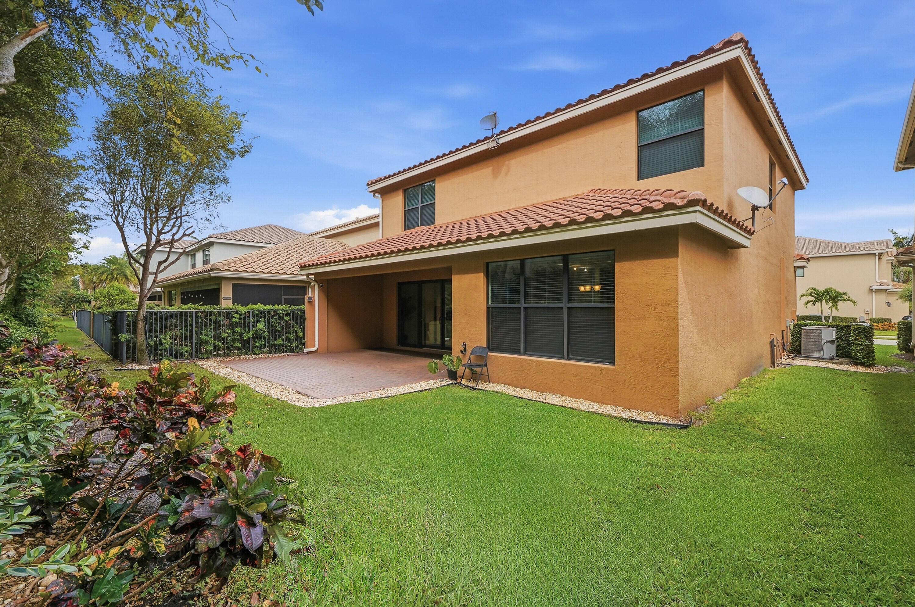 14085 Paverstone Terrace Delray Beach, FL 33446 - Photo 2 of 46 a view of a house with a yard