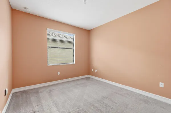 a bedroom with a flat screen tv and a bed