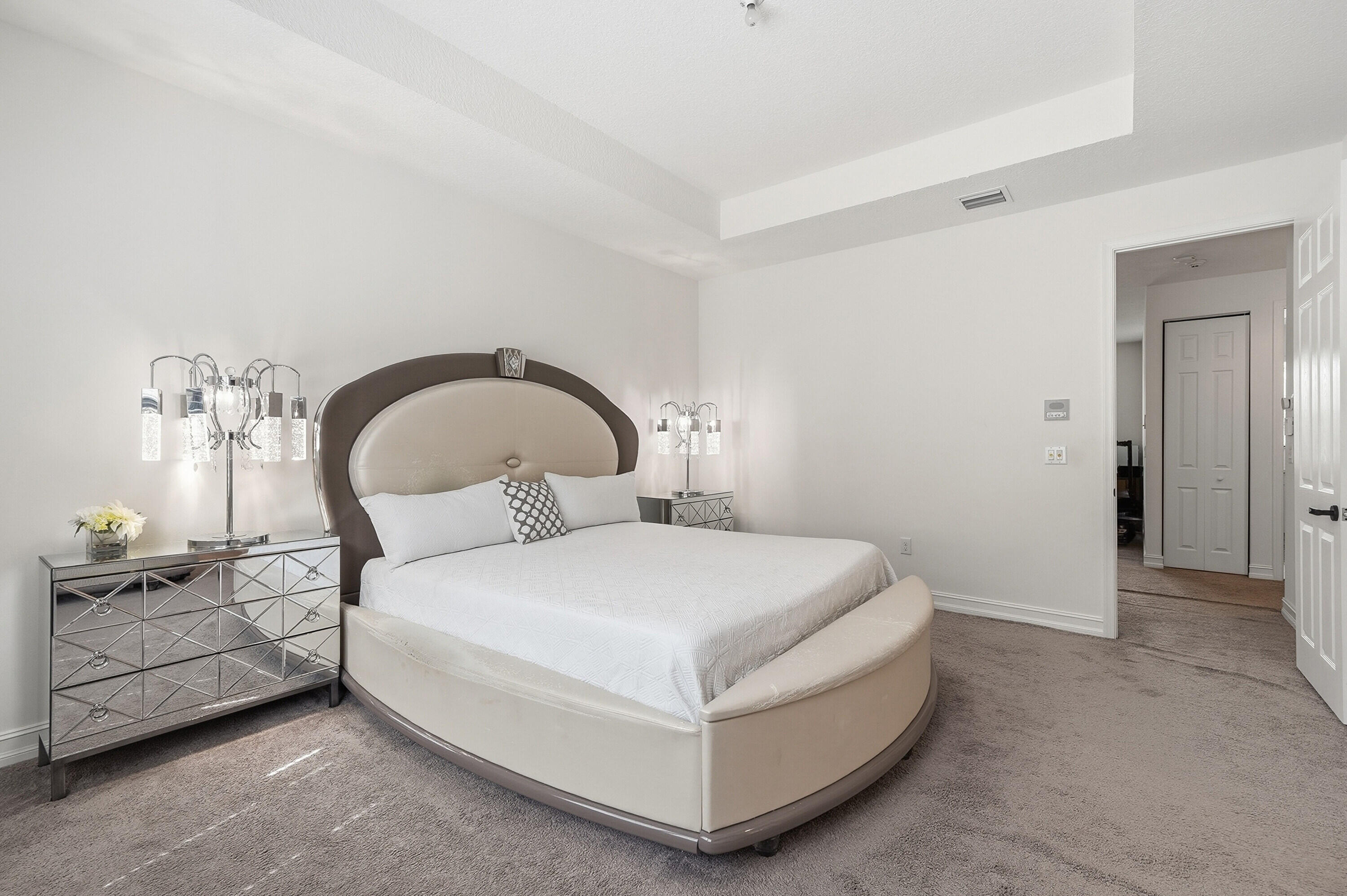 14085 Paverstone Terrace Delray Beach, FL 33446 - Photo 27 of 46 a bedroom with a bed and a chandelier