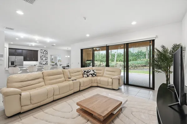 a bedroom with a large bed and a flat screen tv