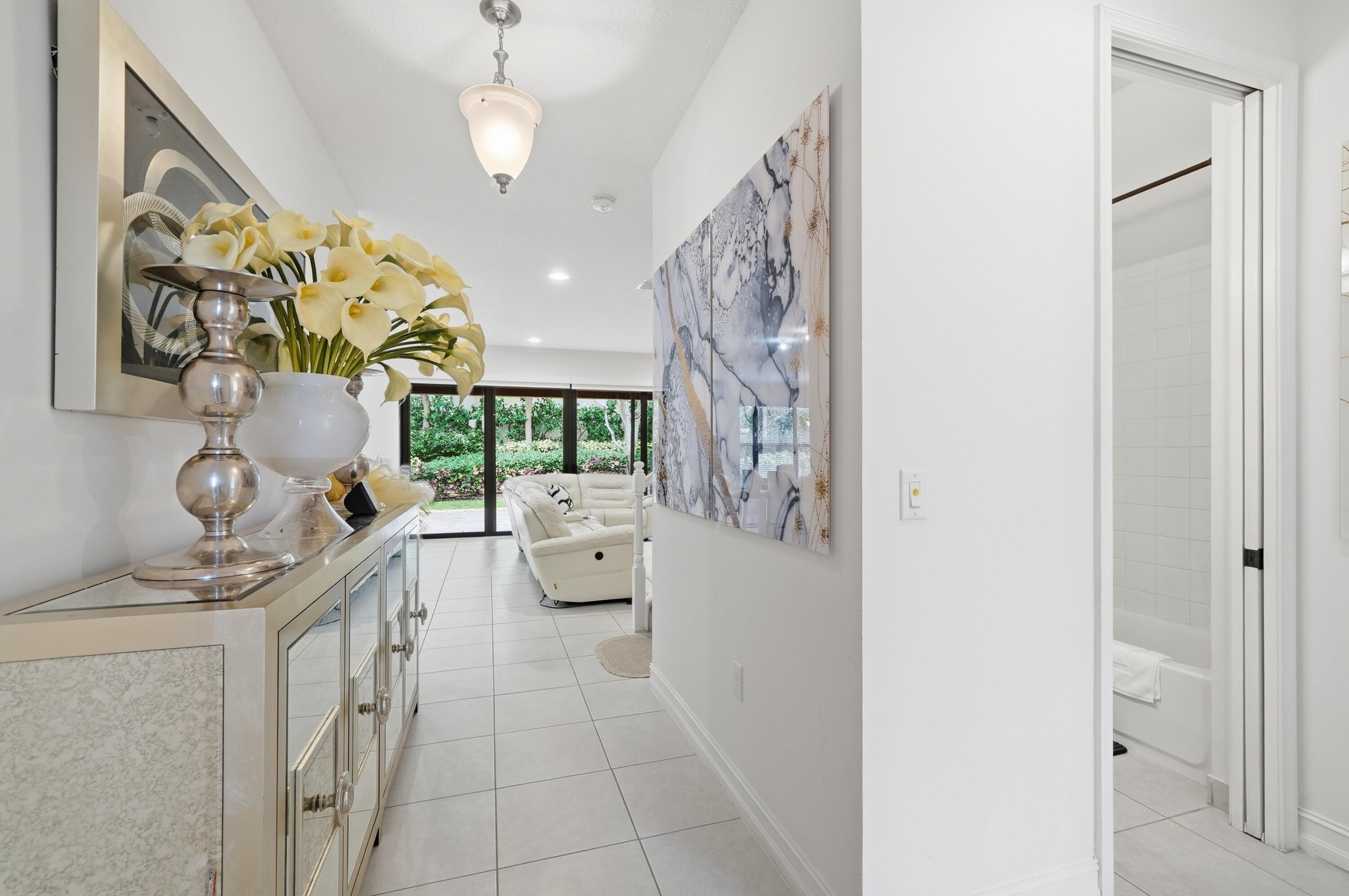 14085 Paverstone Terrace Delray Beach, FL 33446 - Photo 32 of 46 a view of living room with furniture and a chandelier