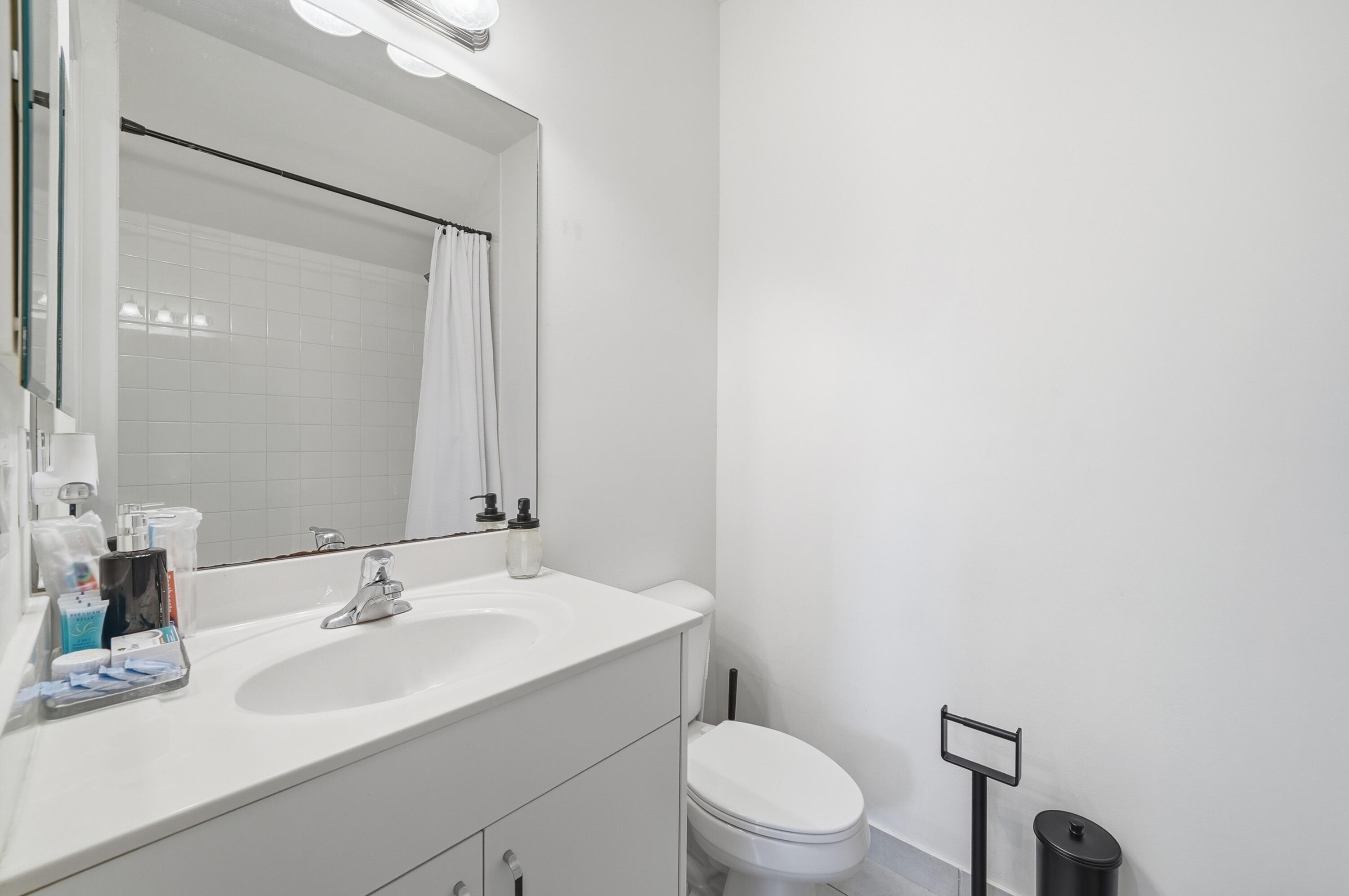 14085 Paverstone Terrace Delray Beach, FL 33446 - Photo 37 of 46 a bathroom with a sink toilet and a mirror