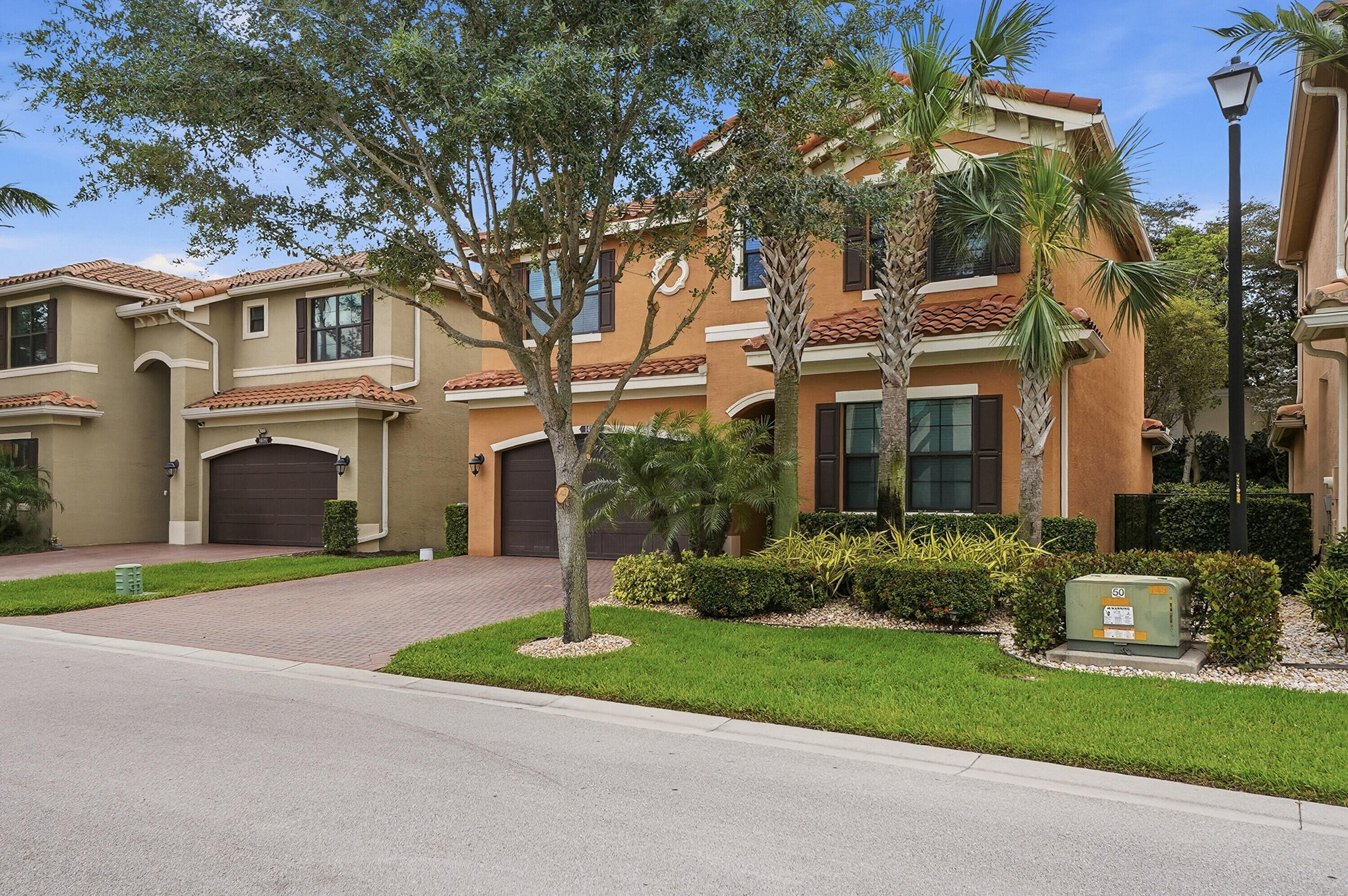 14085 Paverstone Terrace Delray Beach, FL 33446 - Photo 44 of 46 front view of house with a yard