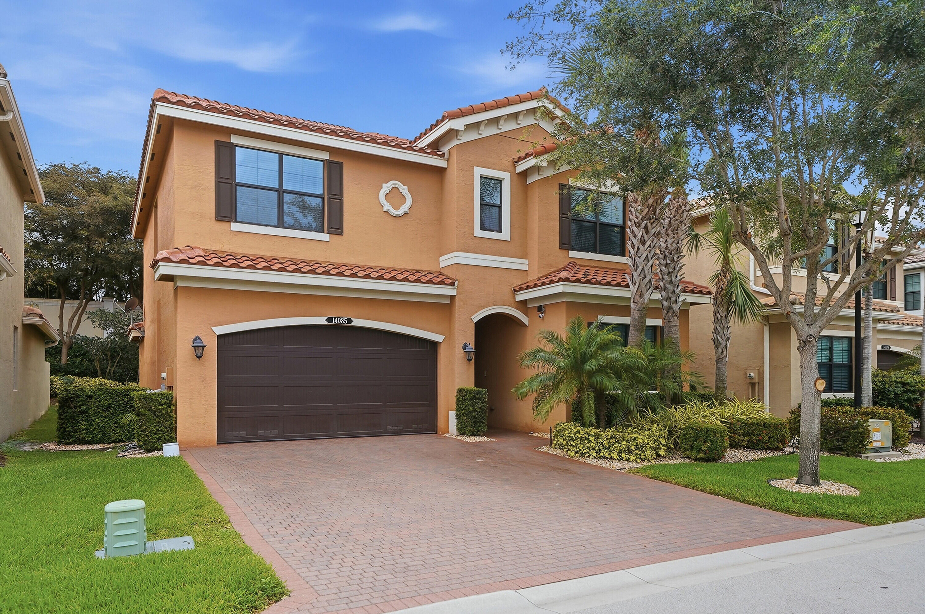 14085 Paverstone Terrace Delray Beach, FL 33446 - Photo 46 of 46 a front view of a house with a yard and garage