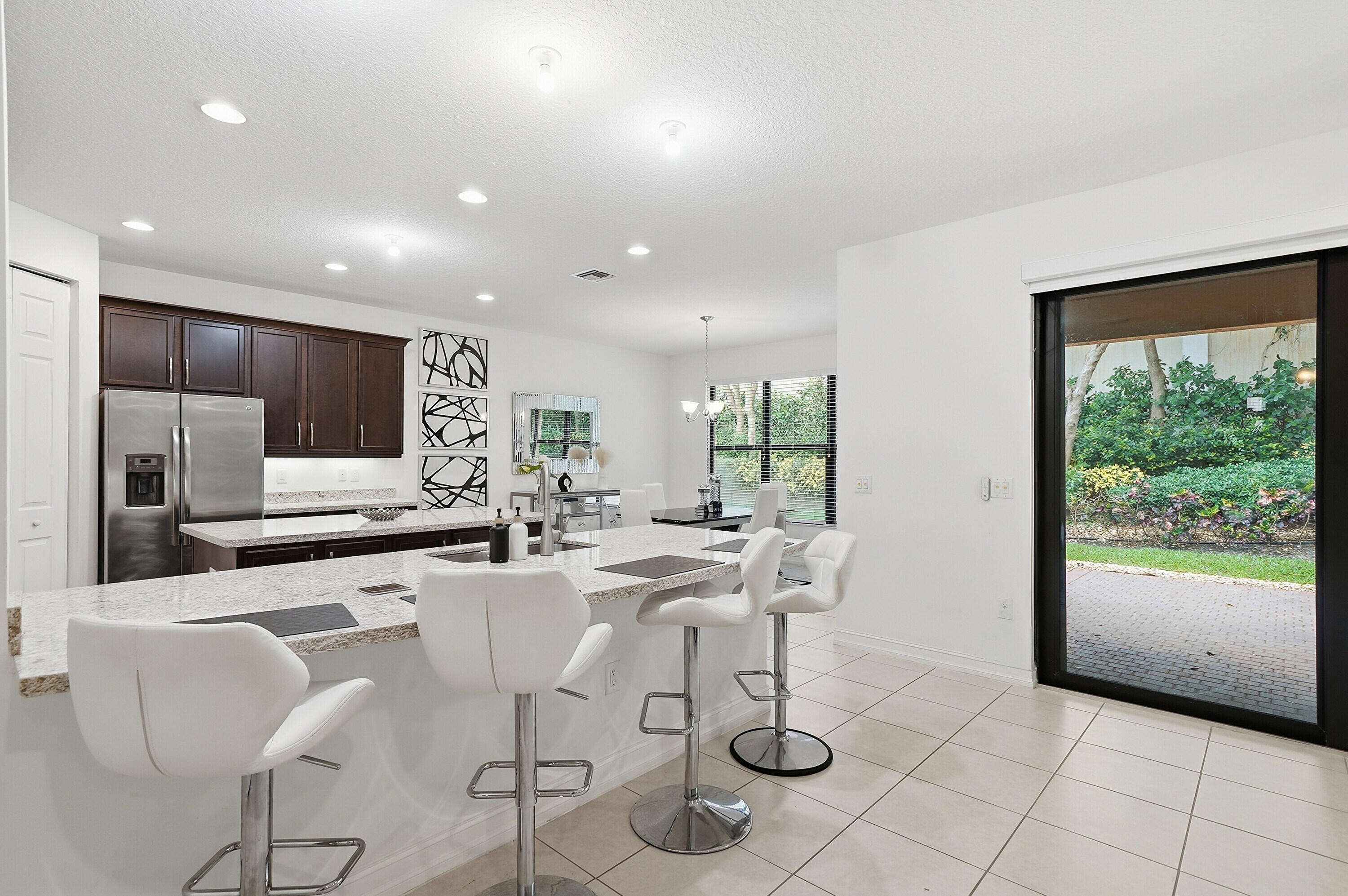 14085 Paverstone Terrace Delray Beach, FL 33446 - Photo 7 of 46 a view of a dining room with furniture window and outside view