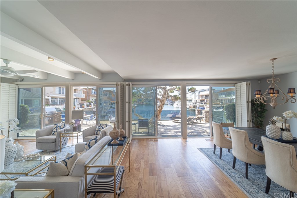 16631 Edgewater Lane Huntington Beach, CA 92649 - Photo 13 of 55 a living room with furniture large windows and wooden floor