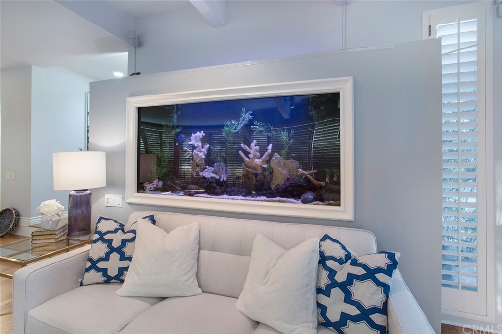 16631 Edgewater Lane Huntington Beach, CA 92649 - Photo 15 of 55 a living room with furniture and a painting on the wall