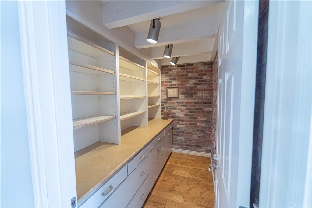 16631 Edgewater Lane Huntington Beach, CA 92649 - Photo 25 of 55 a view of walk in closet with empty racks