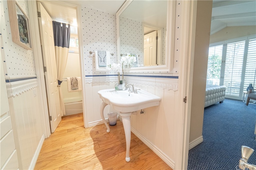 16631 Edgewater Lane Huntington Beach, CA 92649 - Photo 28 of 55 a bathroom with a sink and a mirror