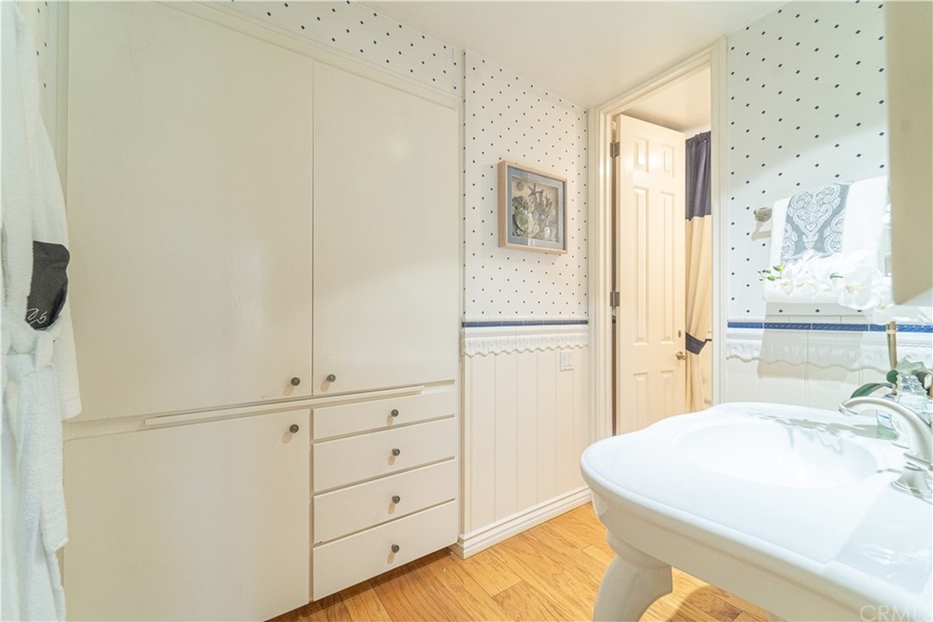 16631 Edgewater Lane Huntington Beach, CA 92649 - Photo 29 of 55 a bedroom with a bed and a dresser