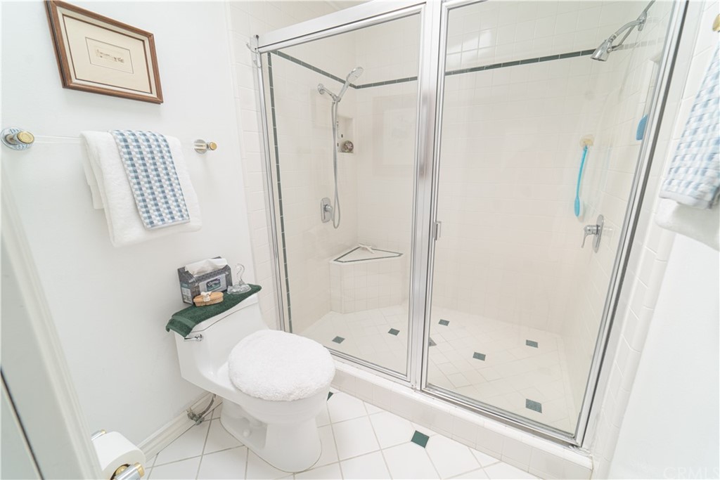 16631 Edgewater Lane Huntington Beach, CA 92649 - Photo 39 of 55 a bathroom with a shower and a toilet