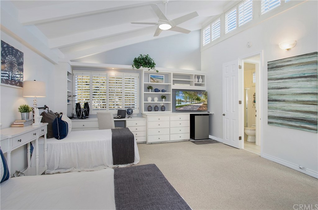 16631 Edgewater Lane Huntington Beach, CA 92649 - Photo 41 of 55 a kitchen with stainless steel appliances kitchen island granite countertop a refrigerator and a stove