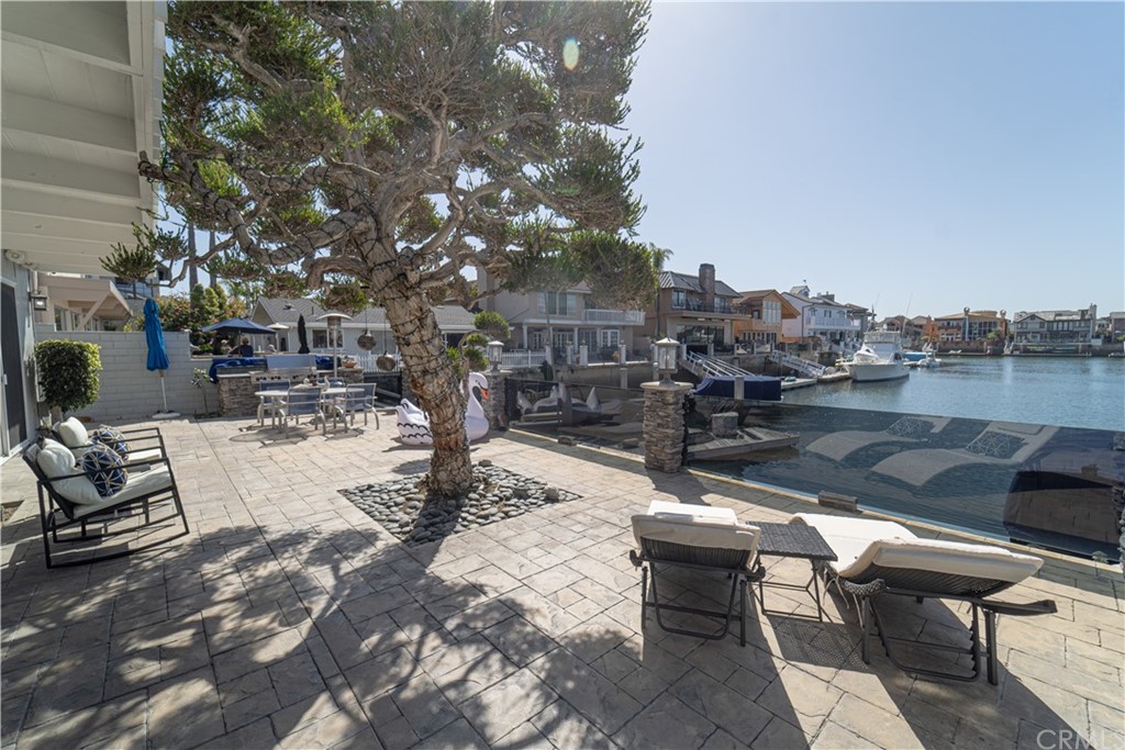 16631 Edgewater Lane Huntington Beach, CA 92649 - Photo 46 of 55 a view of a patio with swimming pool and sitting area