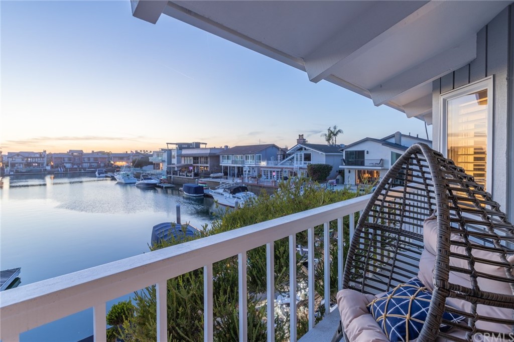 16631 Edgewater Lane Huntington Beach, CA 92649 - Photo 54 of 55 a view of a balcony with lake view and wooden floor