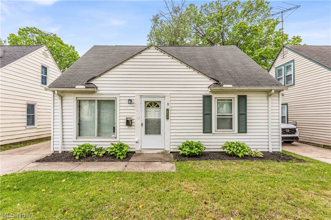 18517 Homeway Road Cleveland, OH 44135 - Photo 2 of 29 White siding exterior with a dark asphalt shingle roof