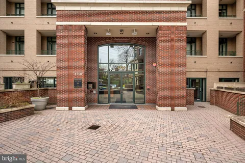 a view of a entryway with a brick wall