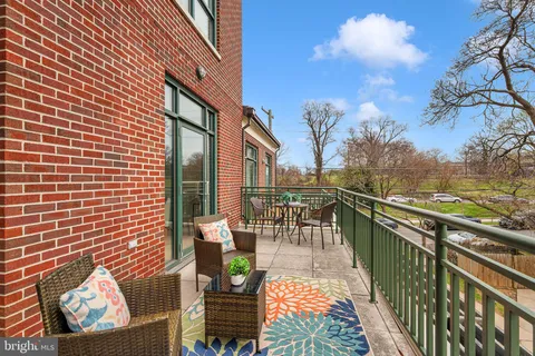 a view of a roof deck with couches