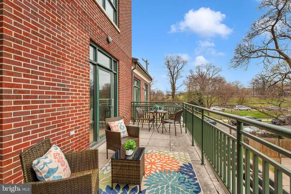 a view of a roof deck with couches