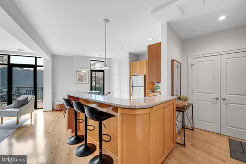 a room with a table chairs and flat screen tv