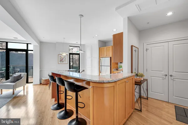 a room with a table chairs and flat screen tv