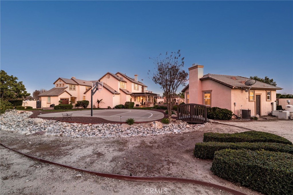 6364 Hidden Brook Place Rancho Cucamonga, CA 91739 - Photo 11 of 61 a view of a house with a yard