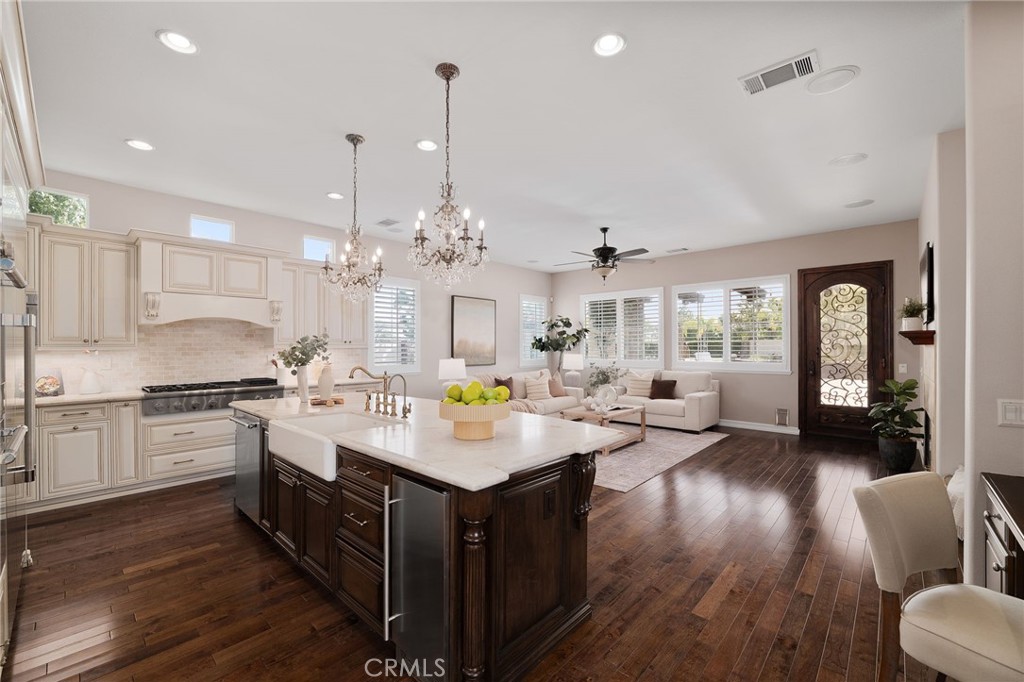 6364 Hidden Brook Place Rancho Cucamonga, CA 91739 - Photo 20 of 61 a open kitchen with sink cabinets and wooden floor