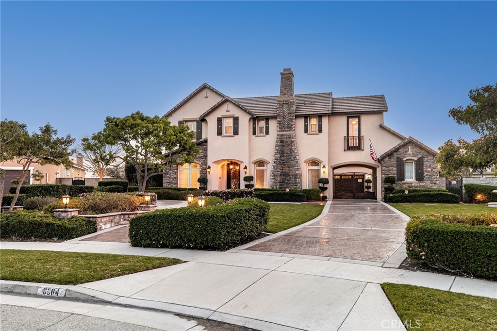 6364 Hidden Brook Place Rancho Cucamonga, CA 91739 - Photo 2 of 61 a front view of a house with a yard