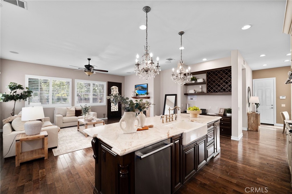 6364 Hidden Brook Place Rancho Cucamonga, CA 91739 - Photo 25 of 61 a view of a dining room and livingroom with furniture wooden floor a chandelier