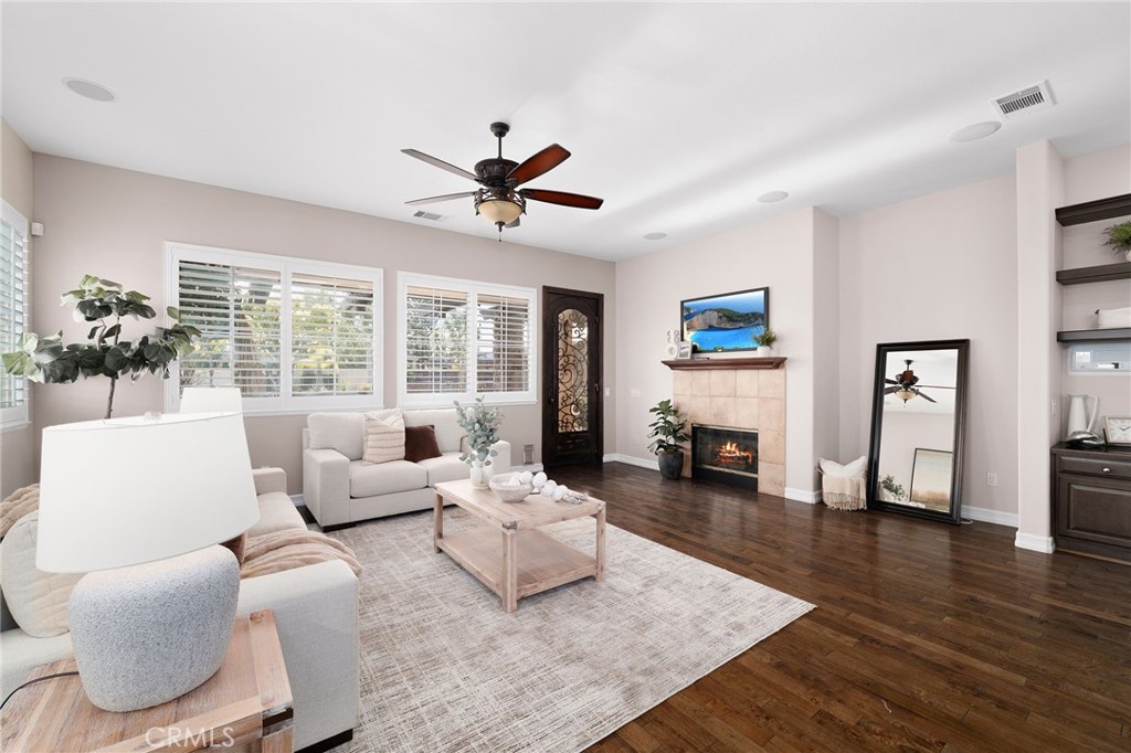 6364 Hidden Brook Place Rancho Cucamonga, CA 91739 - Photo 28 of 61 a living room with furniture and a large window