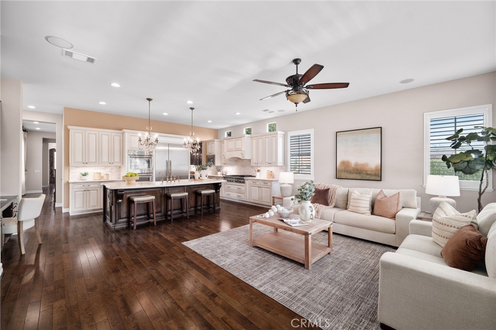 6364 Hidden Brook Place Rancho Cucamonga, CA 91739 - Photo 29 of 61 a living room with furniture and kitchen view