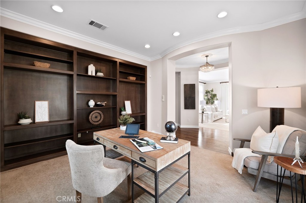 6364 Hidden Brook Place Rancho Cucamonga, CA 91739 - Photo 31 of 61 a living room with furniture a rug and a table