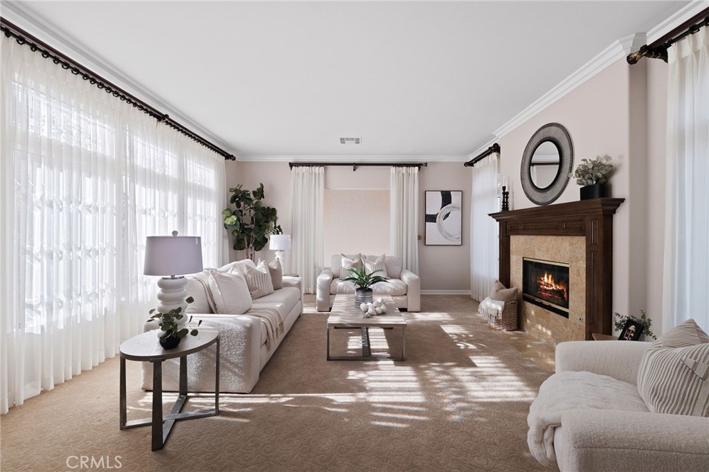 6364 Hidden Brook Place Rancho Cucamonga, CA 91739 - Photo 32 of 61 a living room with furniture a fireplace and a large window